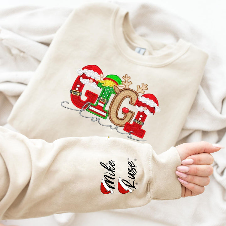 Sweat-shirt de Noël personnalisé « Maman Claus » pour la famille, avec nom Stnta sur la manche.