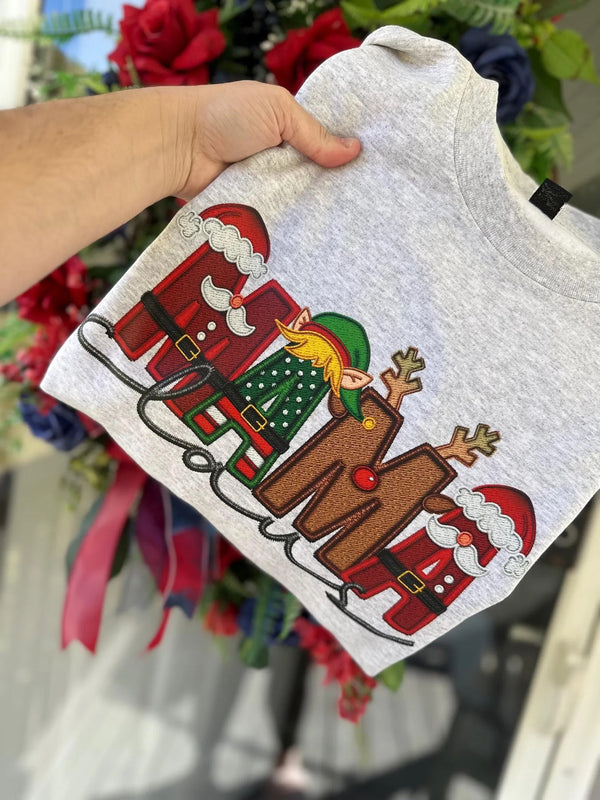 Sweat-shirt de Noël personnalisé « Maman Claus » pour la famille, avec nom Stnta sur la manche.