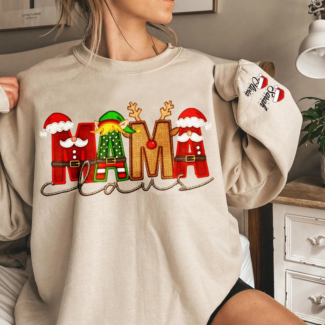 Sweat-shirt de Noël personnalisé « Maman Claus » pour la famille, avec nom Stnta sur la manche.