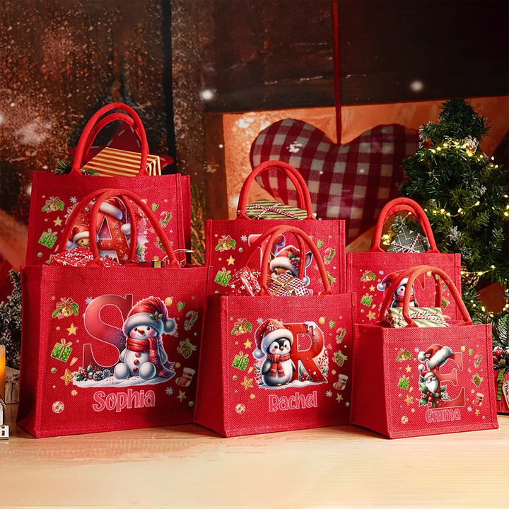 Sac cadeau réutilisable en jute rouge, motif pingouin, renne et bonhomme en pain d'épices, personnalisable, avec initiale et prénom, pour Noël