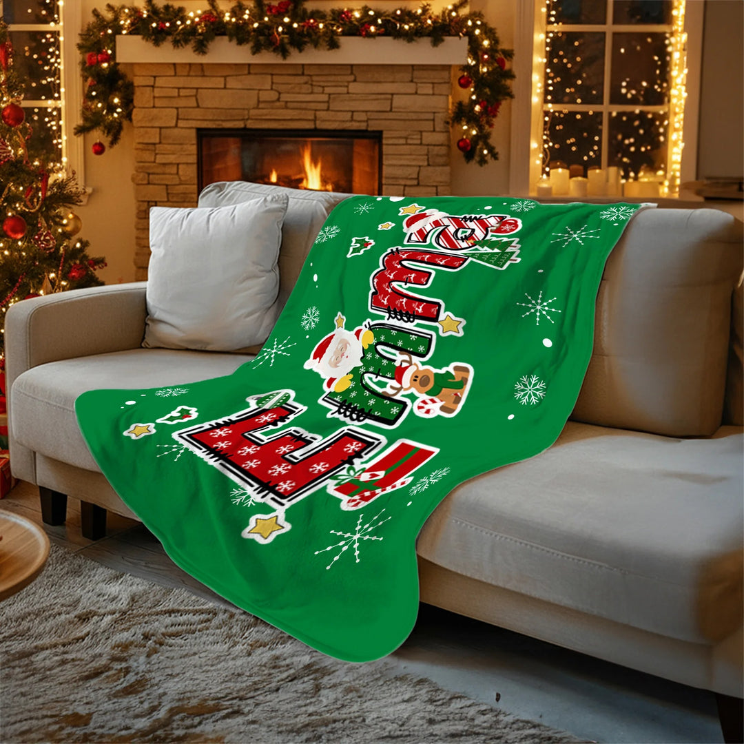 Couverture de Noël personnalisée avec nom de renne et Père Noël, douce et décorative, idéale pour les fêtes de fin d'année.